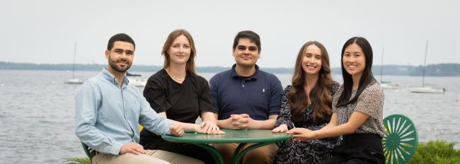 The 2025-26 chief residents sitting at a table outside.